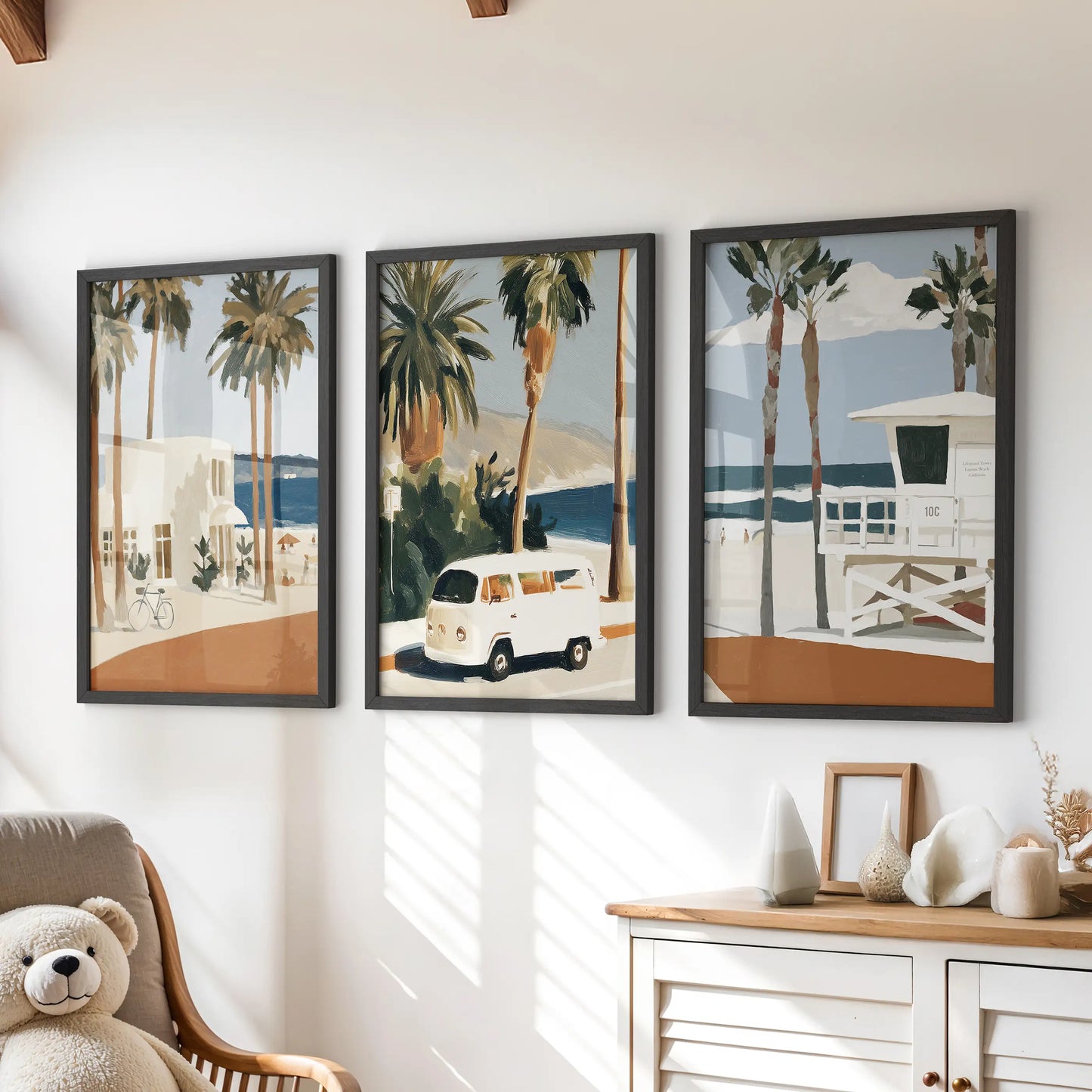 A 3-piece lifeguard tower art set in black frames turns the space above a kids dresser into a playful coastal gallery wall.