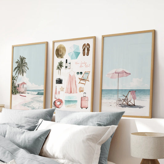 Pink and blue coastal collage, a 3-piece art wall set in oak wood frames, adds soft color above the headboard in a blue bedroom.