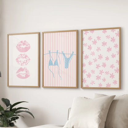 Set of three coquette beach pictures in warm wood frames spans the wall behind the couch, creating an inviting coastal accent.
