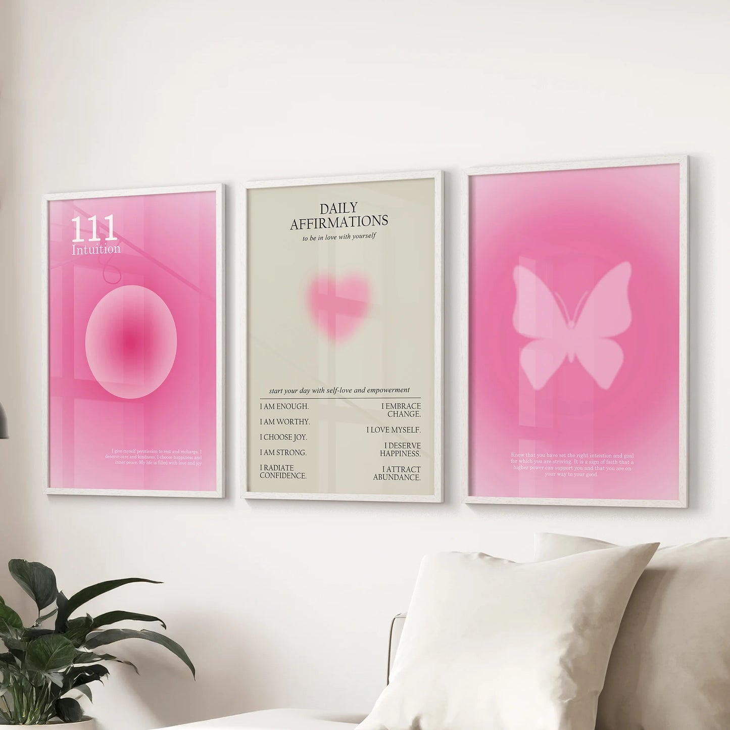 Pink affirmation typography prints, 3-piece wall art, centers a living room above the couch in crisp white frames.
