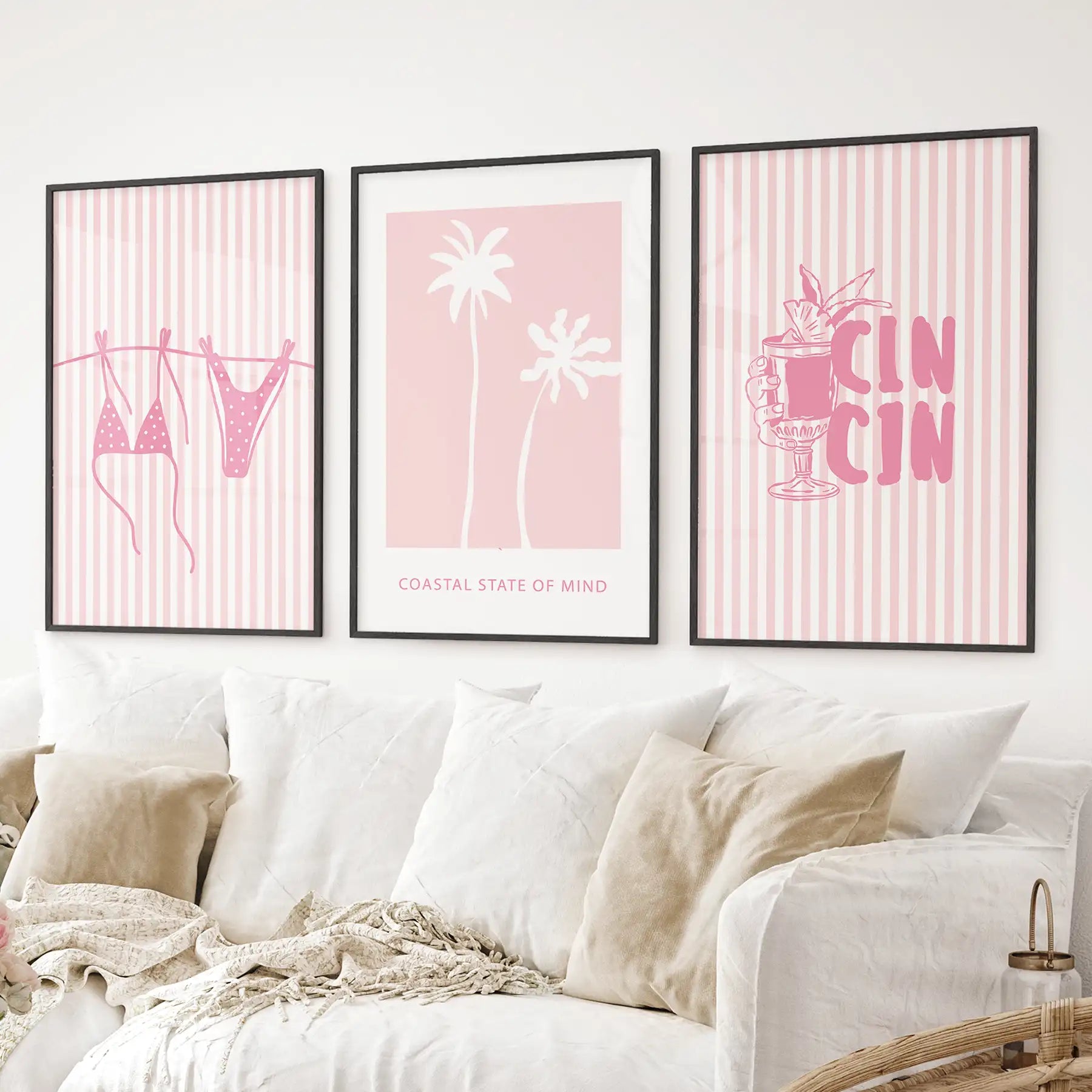 Summer prints featuring beachwear, palm trees, and a tropical drink illustration – fun decor for coastal or teen spaces. Black frames above the sofa.