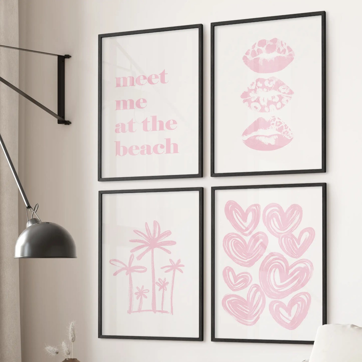 A four-piece wall art set of pink palms and hearts in black frames hangs above the sofa, giving the bright living room a light coastal mood.