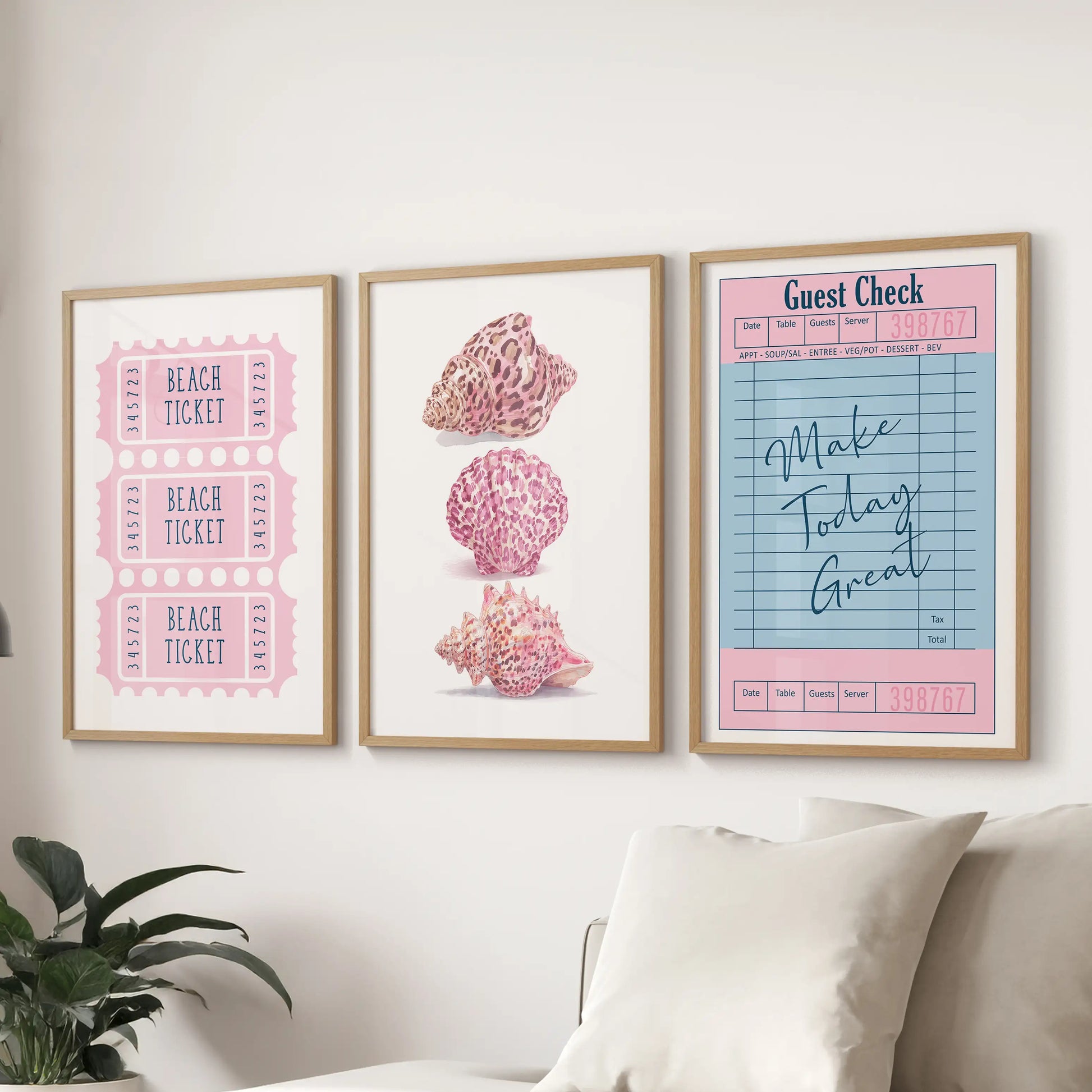 Thin-wood-framed seashell prints create a 3-piece gallery wall behind the sofa, giving the sitting room a soft beachy focus.