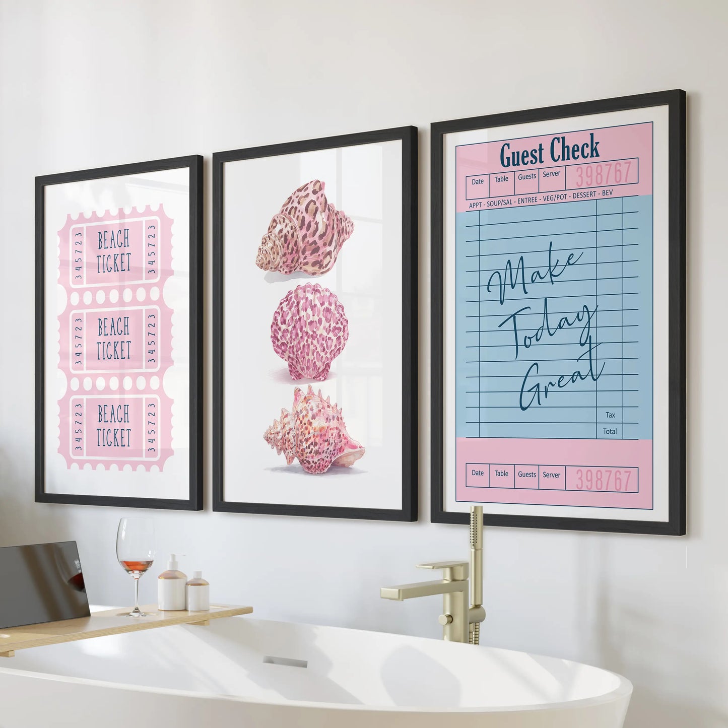 Seashell illustration set of three wall art prints for the bathroom, arranged above the bath in sleek black frames.