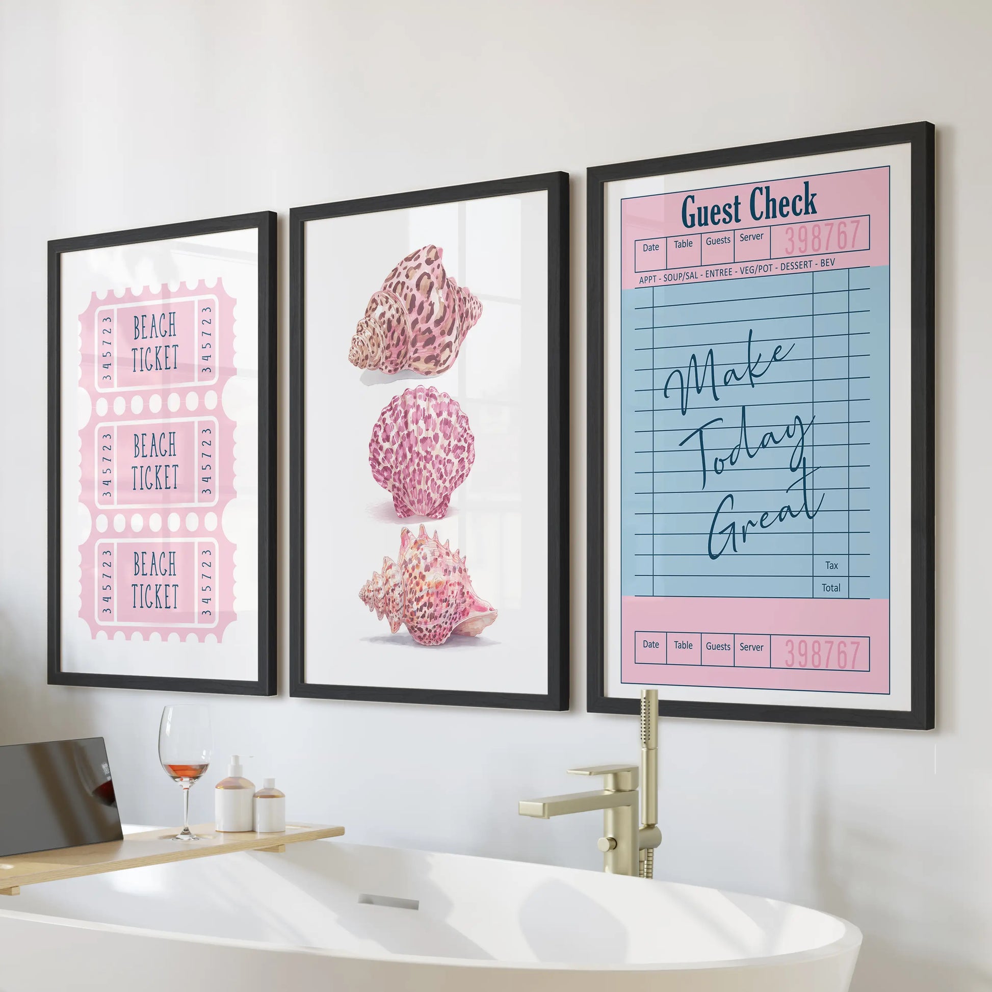 Seashell illustration set of three wall art prints for the bathroom, arranged above the bath in sleek black frames.
