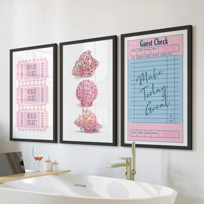 Seashell illustration set of three wall art prints for the bathroom, arranged above the bath in sleek black frames.