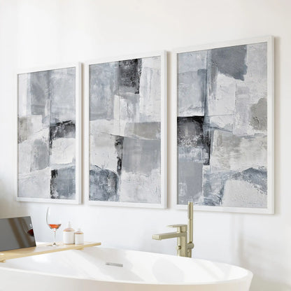 Organic modern shapes large wall art set of 3, finished in white frames, hangs over the tub wall to lend the bathroom a light, spa-like calm.