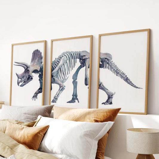 Dinosaur skeleton wall art set featuring triceratops bones in subtle watercolor tones for kids’ bedroom decoration.