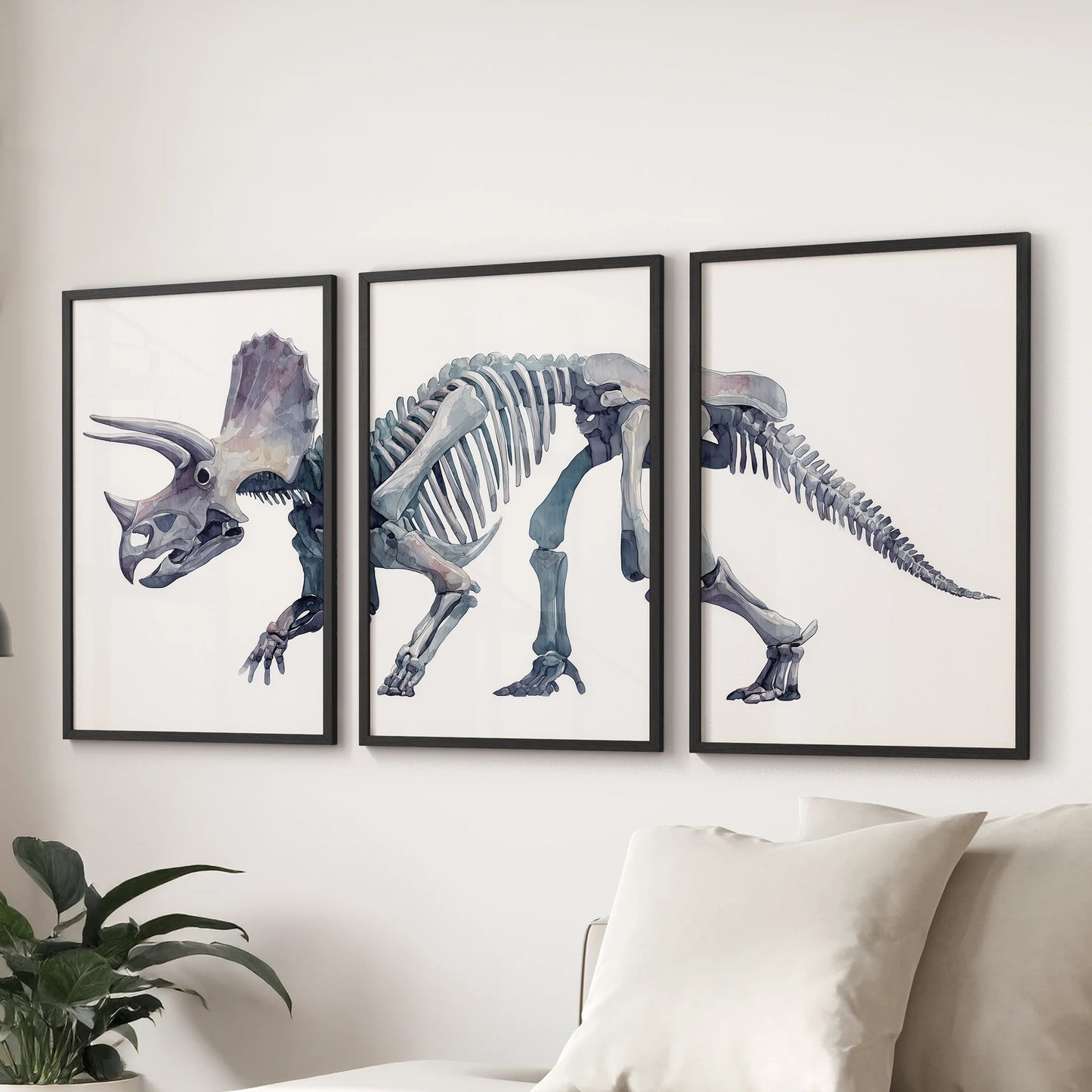 Set of three prehistoric skeleton watercolor prints featuring a triceratops, adding style to a modern nursery.