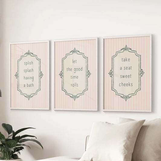 Playful modern wall art, a set of 3 bathroom sign posters in white frames, livens the living room space just behind the sofa.