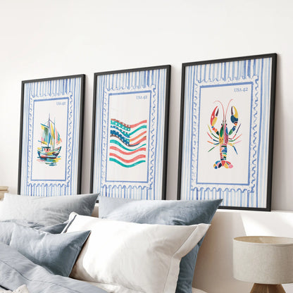 Bright coastal scenes in a wall art triptych, finished with black frames and hung over the bed’s headboard to anchor a serene blue bedroom.