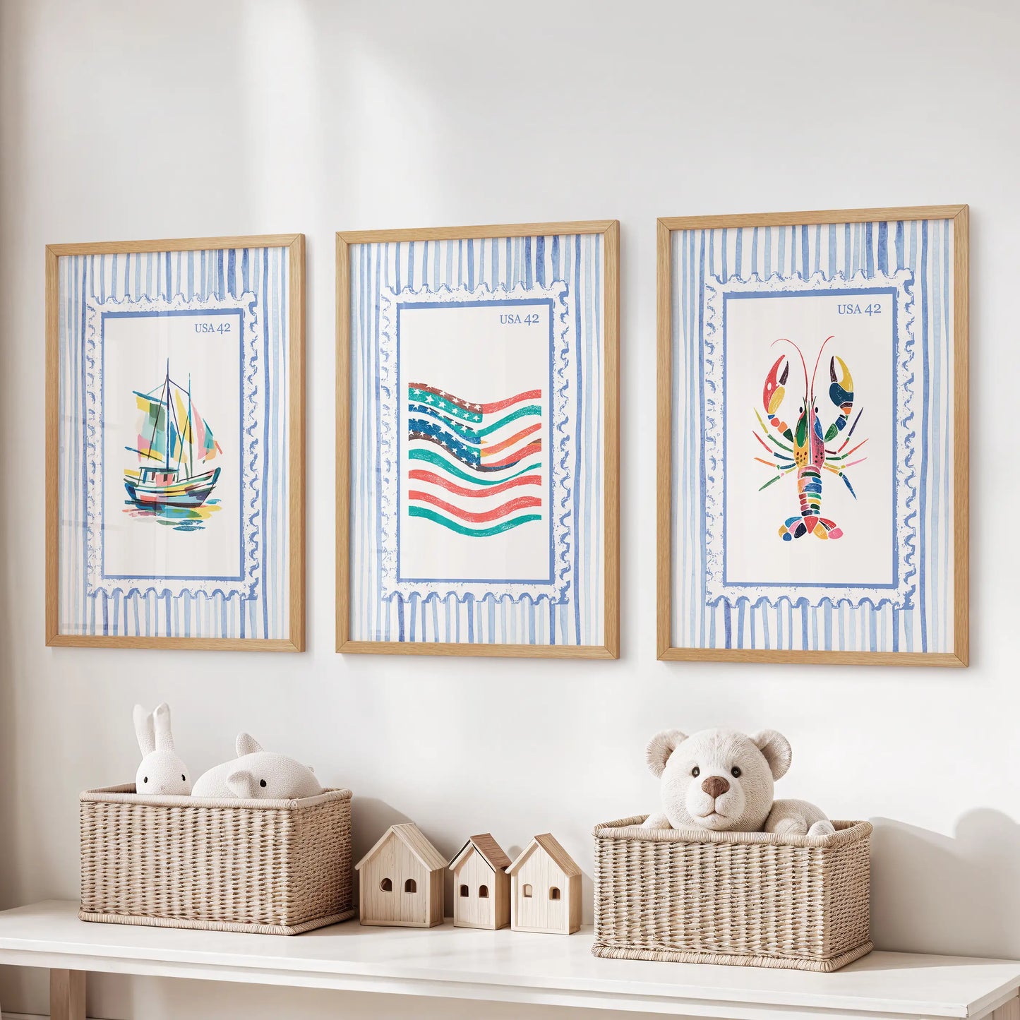 A trio of ocean-themed prints in light oak frames hangs above the toy bench, sparking playful, sea-breezy warmth in the kids’ room.