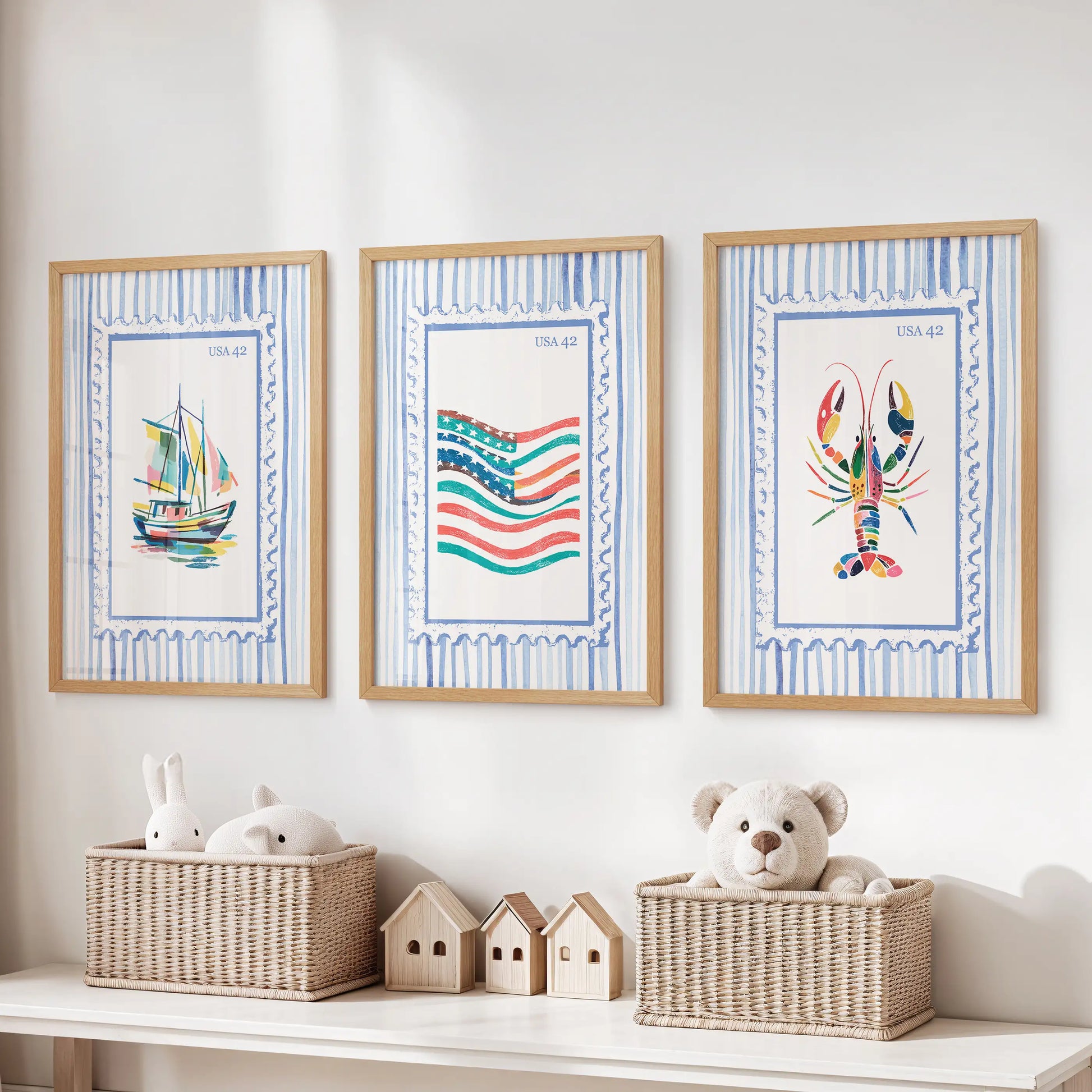 A trio of ocean-themed prints in light oak frames hangs above the toy bench, sparking playful, sea-breezy warmth in the kids’ room.