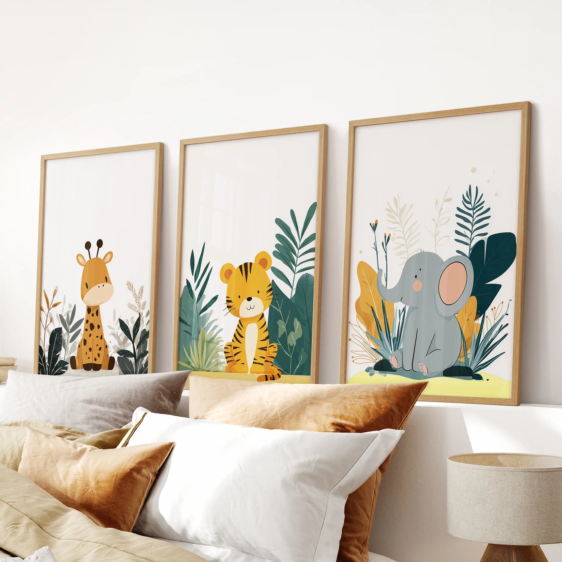 Сute animal prints, a gallery wall set of 3 in slim wooden frames, lines the bedroom wall over the headboard for a tidy, playful look.