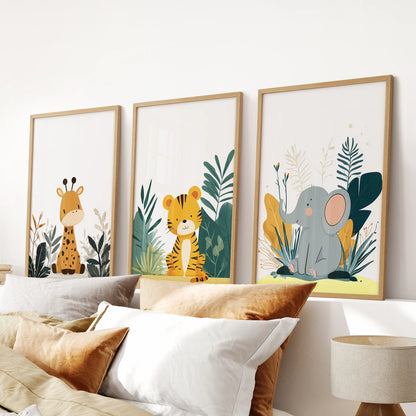 Сute animal prints, a gallery wall set of 3 in slim wooden frames, lines the bedroom wall over the headboard for a tidy, playful look.