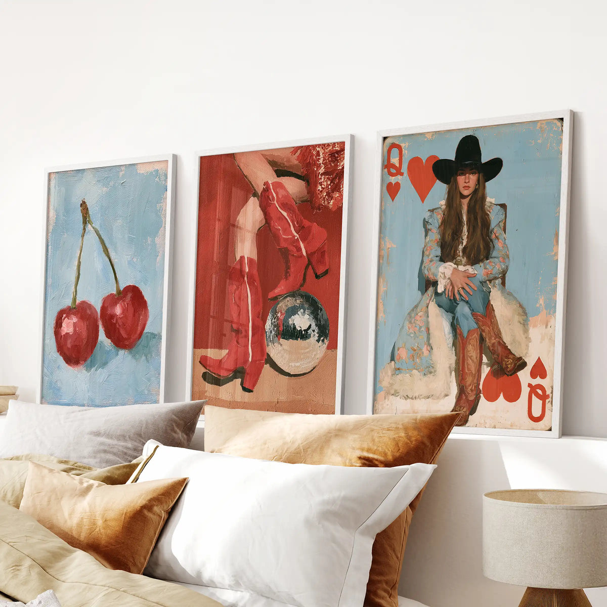 Three cowgirl boots wall prints in clean white frames are positioned above the bed, grounding the bedroom with playful Western style.