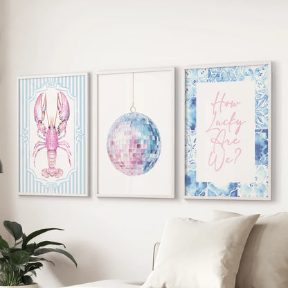 How Lucky Are We quote wall art trio in white frames centers the sitting room, perched above the couch with breezy coastal charm.