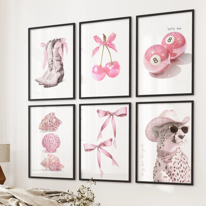 A six-piece wall art set with pink cheetah designs, framed in sleek black, gives the bedroom wall above the bed a chic coquette touch.