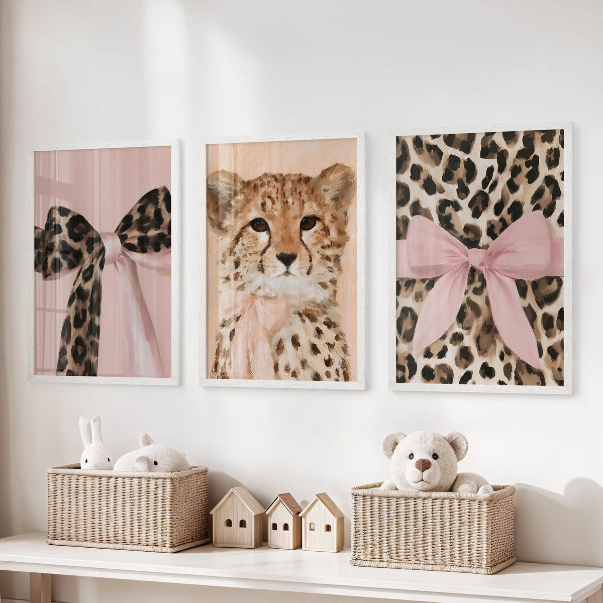 Cheetah and leopard art trio, three-piece wall decor in white frames, lined above toy storage to keep the playroom lively yet neat.