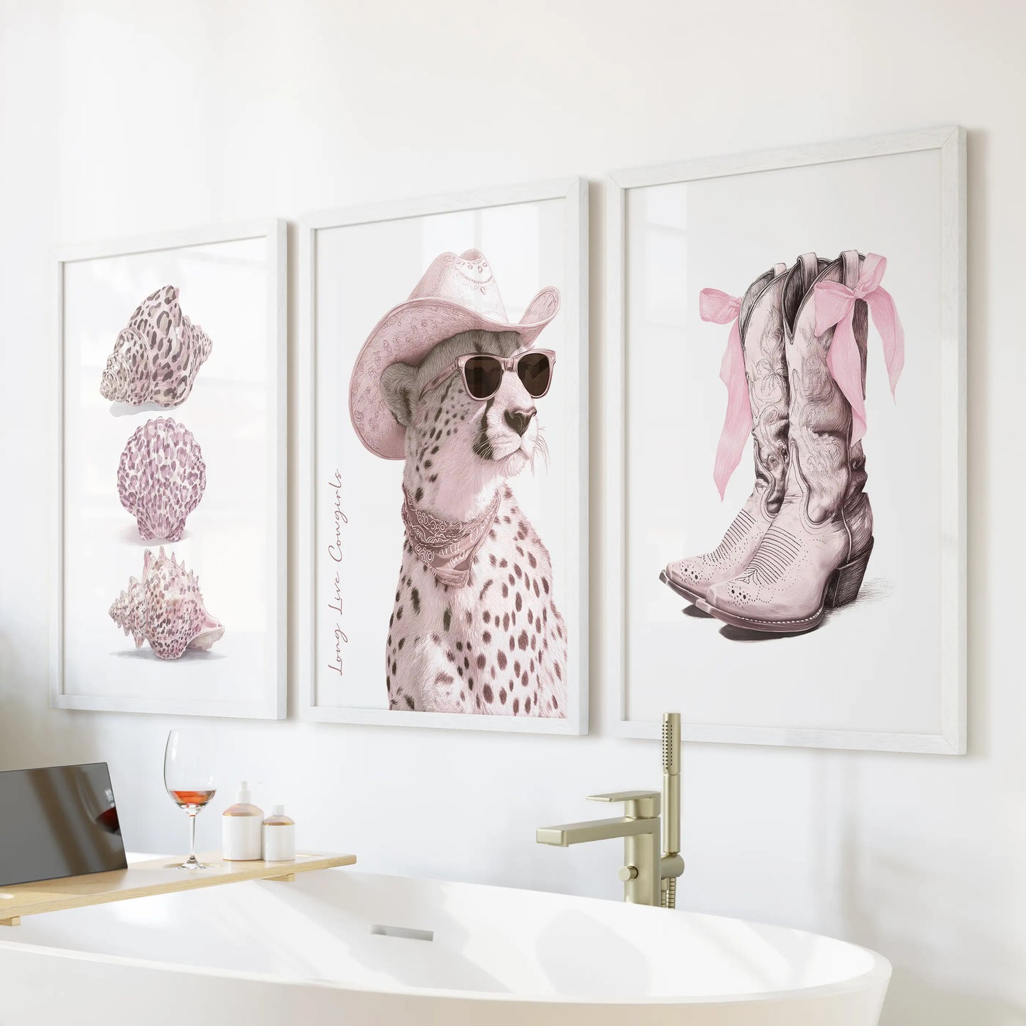 Coquette boots with bows, seashells and cheetah wall art trio in white frames floats above a freestanding tub, adding soft pink ribbons and airy charm to a serene bathroom.