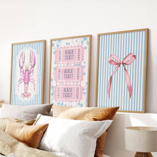 A trio of coquette bow prints in smooth wood frames sits neatly over the headboard, sweetening the light blue bedroom vibe.