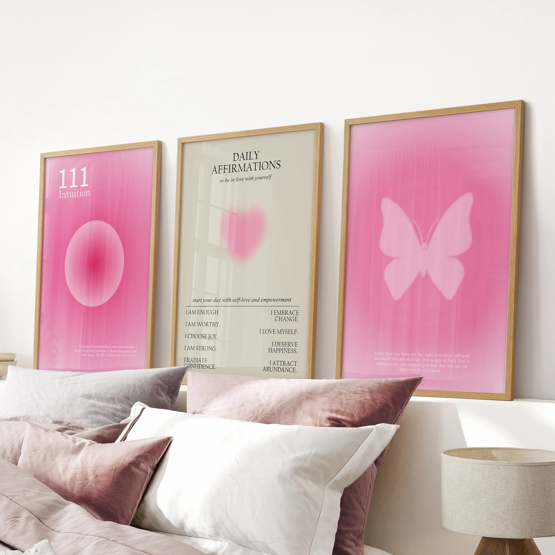 Preppy Y2K affirmation posters, three-piece wall decor, anchor a pink bedroom over the bed headboard in natural wood frames with polish.