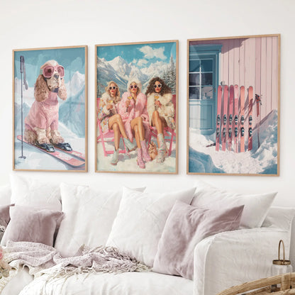 Ski wall art set of 3 featuring dog in pink ski gear, glamorous ski girls, and cabin with pink skis. Thinwood frame over the couch.