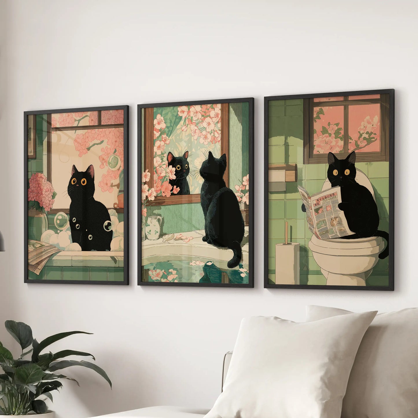 Maximalist Japanese cat illustration, a set of three black-framed wall prints, anchors the living room display behind the couch with bold whimsy.