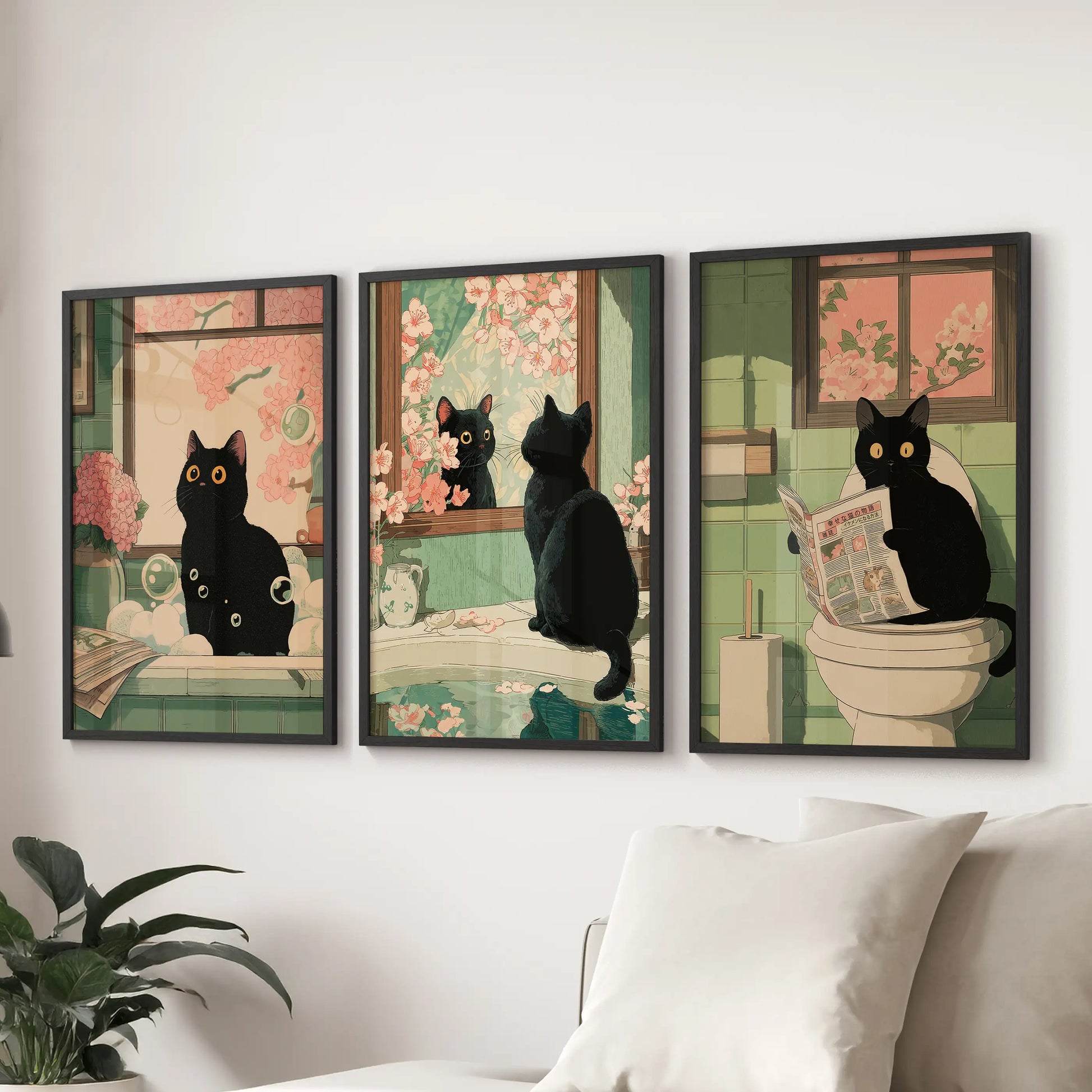 Maximalist Japanese cat illustration, a set of three black-framed wall prints, anchors the living room display behind the couch with bold whimsy.