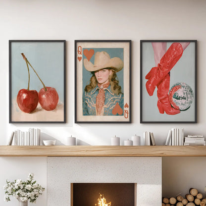 Playing card art trio, presented as black-framed wall decor, lines up neatly above the mantel to bring a graphic wink to the family room.