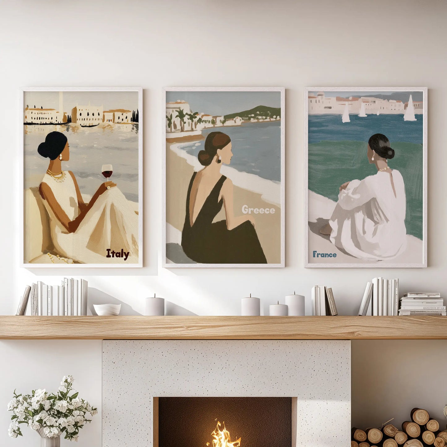 A trio of white-framed coastal wall prints lines the family-room mantle, bringing a breezy, sun-washed shoreline atmosphere indoors.