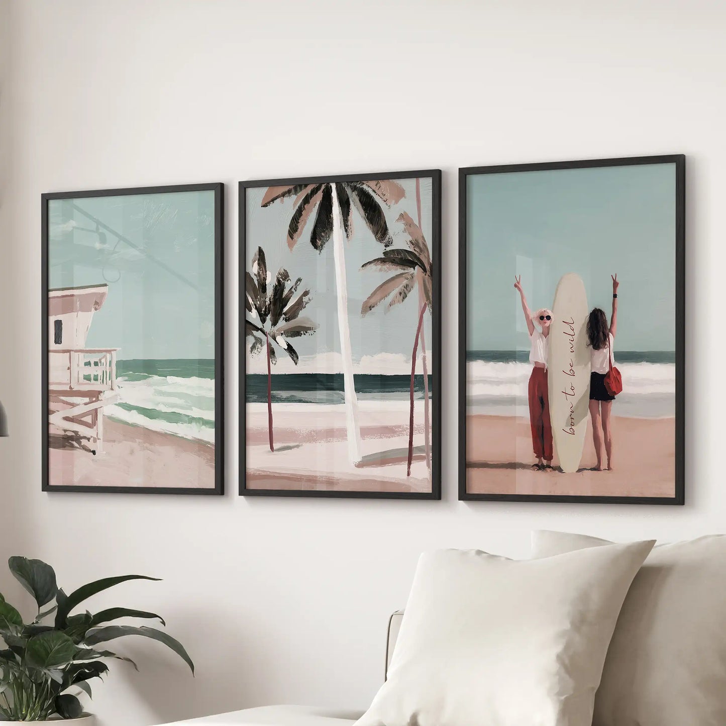 Coastal dunes with sea grass, a set of three wall prints, shown in black frames behind the couch to lend soft, Hamptons-inspired texture to the living room.