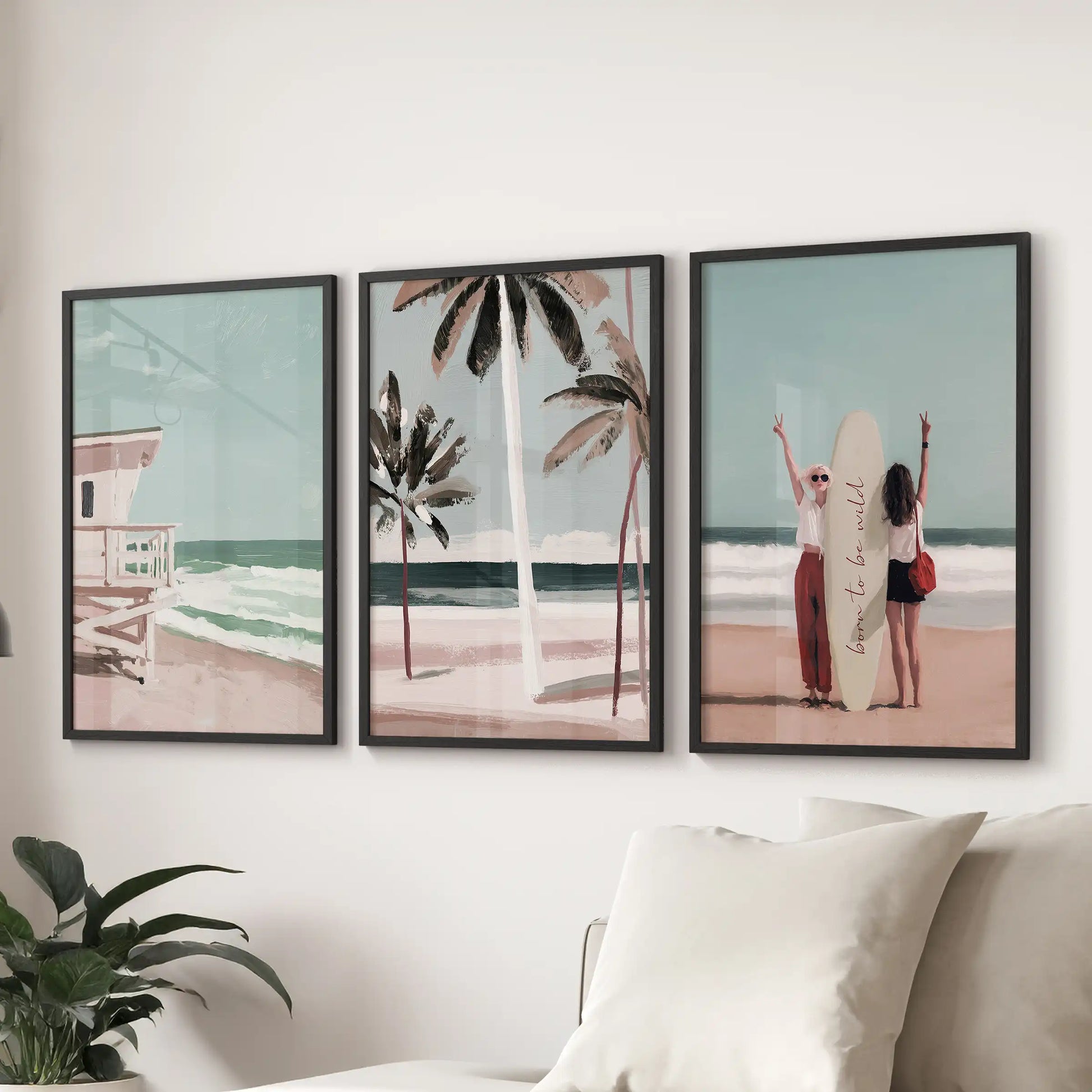 Coastal dunes with sea grass, a set of three wall prints, shown in black frames behind the couch to lend soft, Hamptons-inspired texture to the living room.