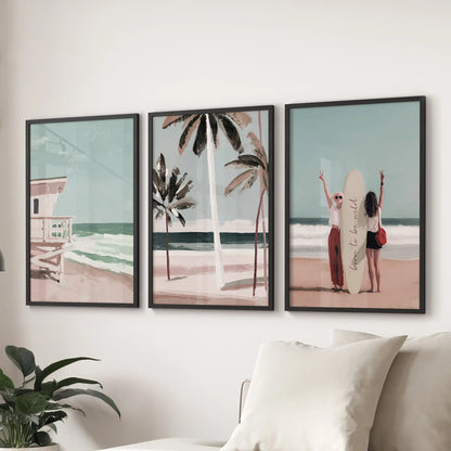 Coastal dunes with sea grass, a set of three wall prints, shown in black frames behind the couch to lend soft, Hamptons-inspired texture to the living room.