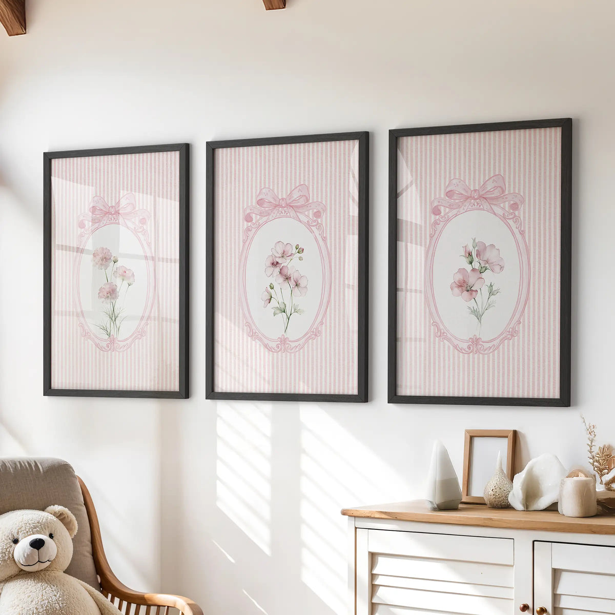 Retro botanical artwork in a three-piece wall art set, with black frames over a chest of drawers in a playroom.