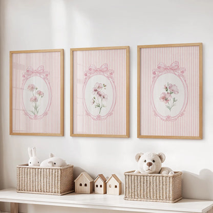 Three-piece retro botanical wall art set in wooden frames above a toy storage bench in the kids' room.