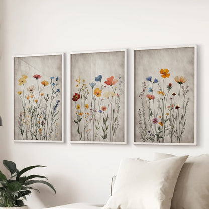 Retro botanical posters, a print set of 3 for the wall in crisp white frames, scaled to anchor the living room space behind the sofa.