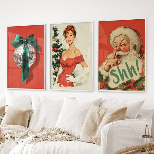 Retro holiday wall art trio – festive Santa, pin-up girl, and disco ball. White frames for living room.