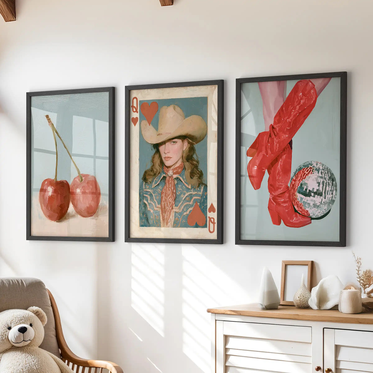 Retro cowgirl wall prints, a set of three in crisp black frames, sit neatly above the chest of drawers in the children's room.