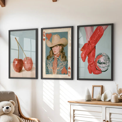 Retro cowgirl wall prints, a set of three in crisp black frames, sit neatly above the chest of drawers in the children's room.