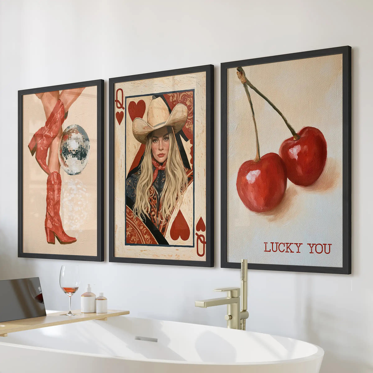 A trio of retro western boots wall art in black frames hangs over a freestanding tub, bringing playful cowgirl flair to the bathroom.
