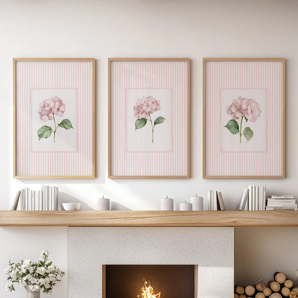 Three-piece wall decor set of blush pink flowers in natural wood frames over a living room hearth.