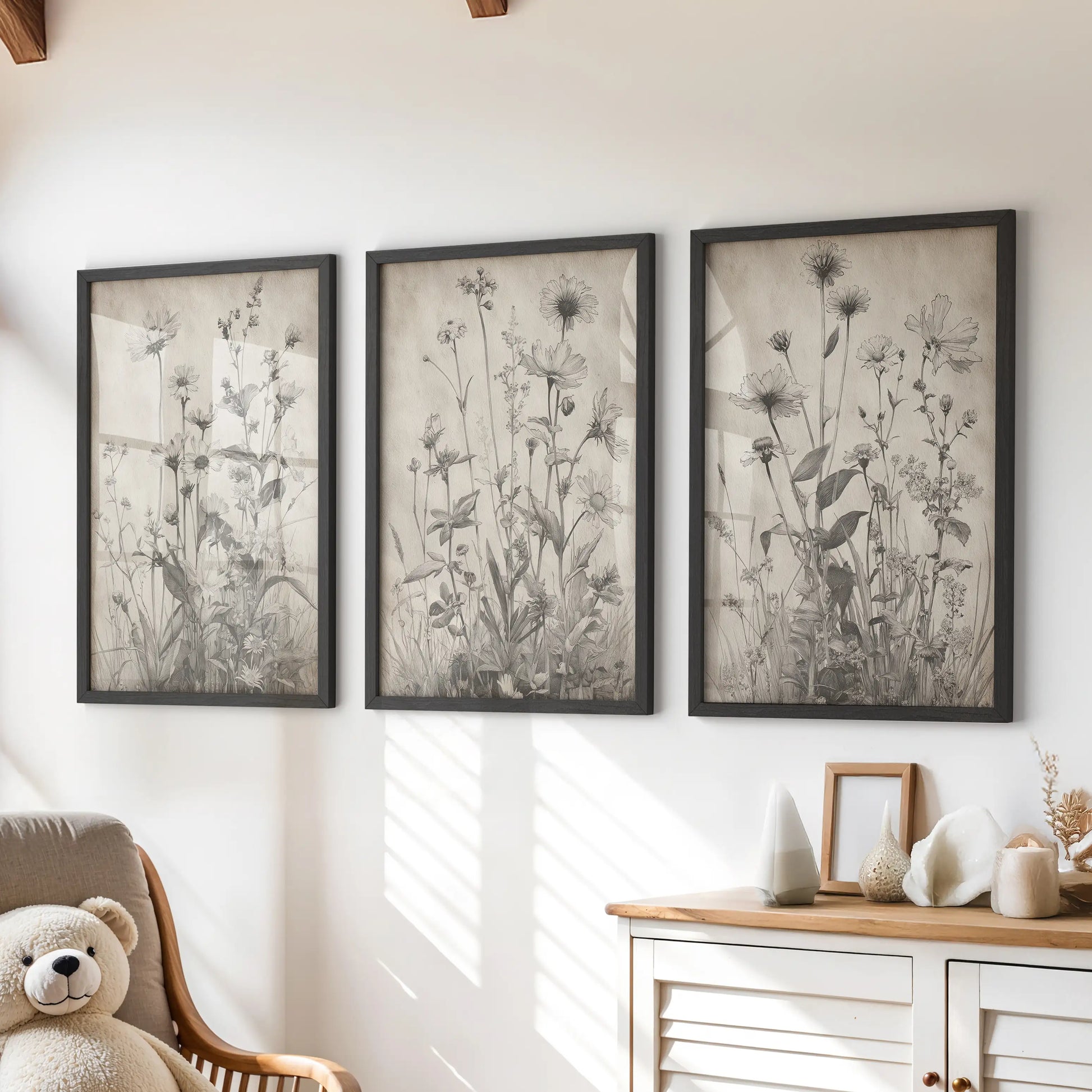 Vintage botanical prints, a three-piece wall art set in black frames, add soft, rustic character to a kids room over the chest of drawers.