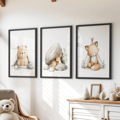 Playful woodland animal wall decor, a 3-piece set in sleek black frames, adds a cheerful touch over the dresser in a children's room.