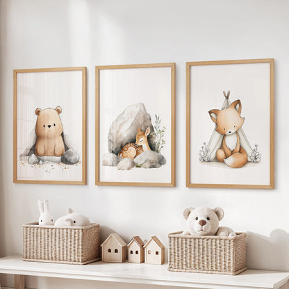 Forest animal wall decor, a set of three in light wood frames, lines the area above the storage bench to calm a lively kids room.