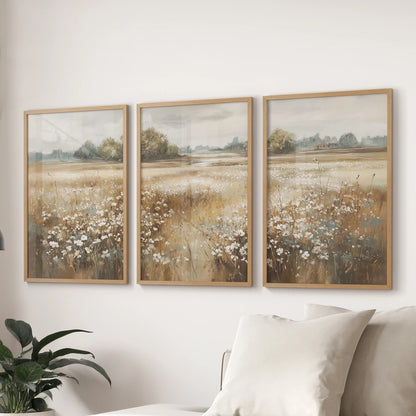 Muted wildflower prints, a trio in natural wood frames, hang above the sectional in the sitting room for a quiet, pastoral accent that feels effortlessly collected.