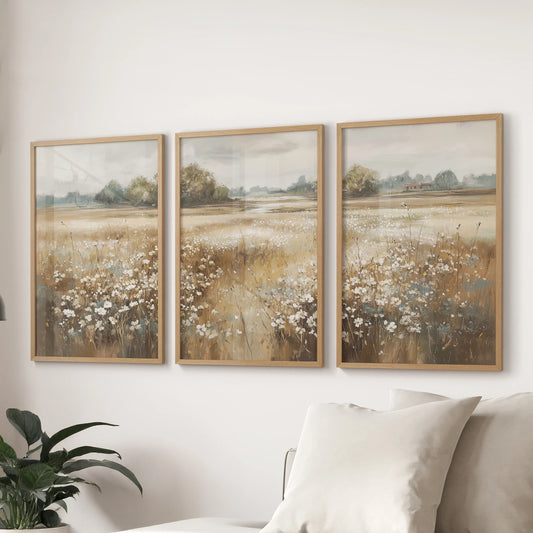 Muted wildflower prints, a trio in natural wood frames, hang above the sectional in the sitting room for a quiet, pastoral accent that feels effortlessly collected.