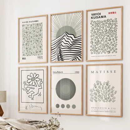 Sage green Matisse and Kusama prints in wood frames, 6-piece modern gallery wall above bed