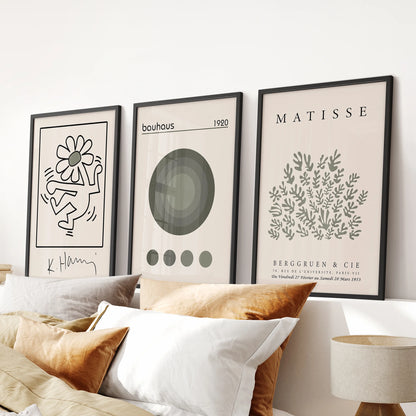 Sage green exhibition posters, 3-piece wall art set for a bedroom, black-framed and sized to hang over the bed for a calm, modern focal point.