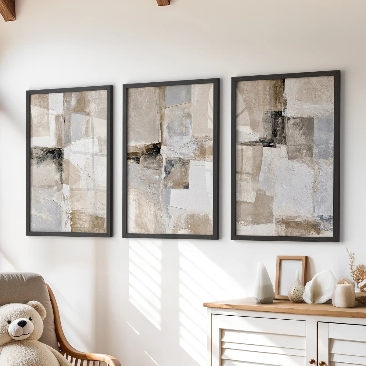 Organic minimalist shapes in a set of three framed prints style a kids playroom above the chest of drawers, paired with crisp black frames.